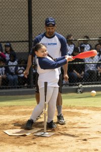 A student bats at NYC Autism Charter Schools' annual All Star Game. 